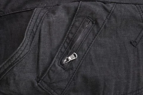 Black jeans texture with sewing pattern  and zipper, abstract close up backdr Stock Photos