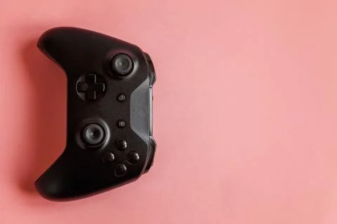 Black joystick on pink background. Computer gaming competition videogame cont Stock Photos