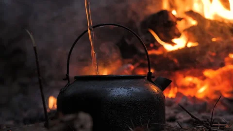 Black Kettle Heating Over Campfire Flames Stock Footage 307857525