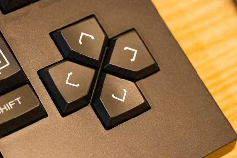 Black keyboard with arrow keys up down left right view Stock Photos