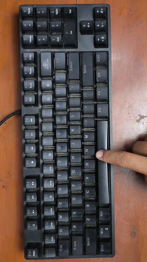 Black keyboard sits on wooden surface Stock Footage 339564864