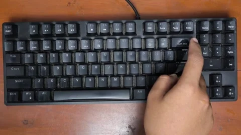 Black keyboard sits on wooden surface Stock-Footage 344624743