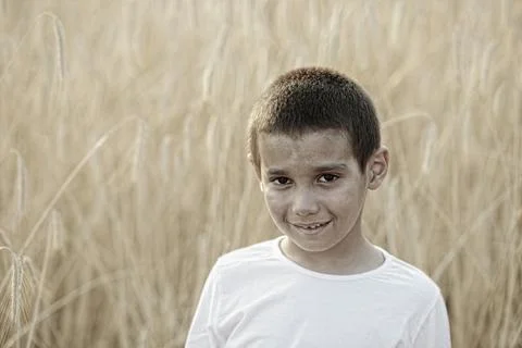 Black kid in field Stock Photos