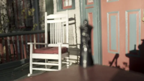 Black king chess piece sitting on pourch infront of house Stock Footage 91094498