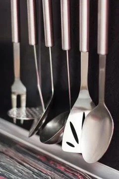 Black kitchen with kitchen utensils Foto stock