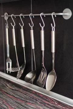 Black kitchen with kitchen utensils Stock Photos