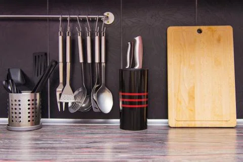 Black kitchen with kitchen utensils Stock Photos
