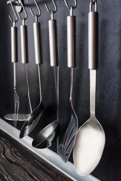 Black kitchen with kitchen utensils Stock Photos