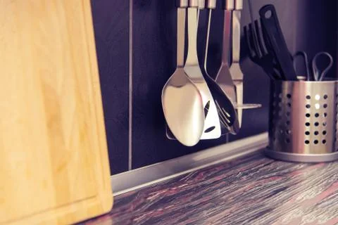 Black kitchen with kitchen utensils Stock Photos