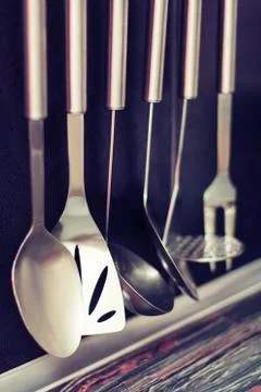 Black kitchen with kitchen utensils Stock Photos