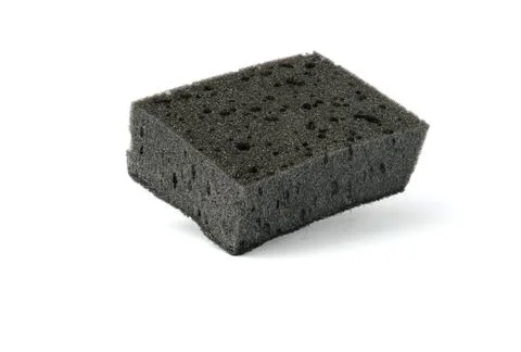 Black kitchen sponge isolated on white . the concept of cleanliness and order Stock Photos