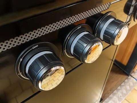 Black Kitchen Stove Control Knobs with Off Position Stock Photos