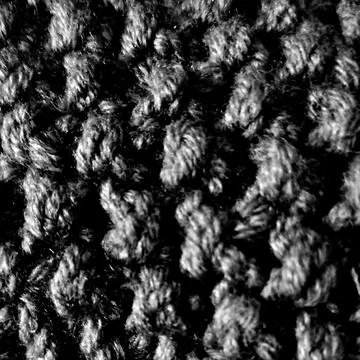 Black knitted wool texture background close up Stock Photos