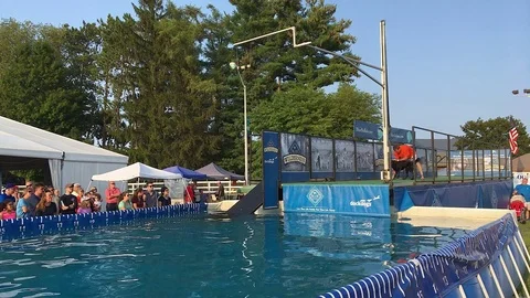 Black Lab Participates in Dog High Jump Competition Stock Footage 79794009