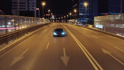 Black lamborghini supercar driving on an empty city highway at night Stock-Footage 341958717