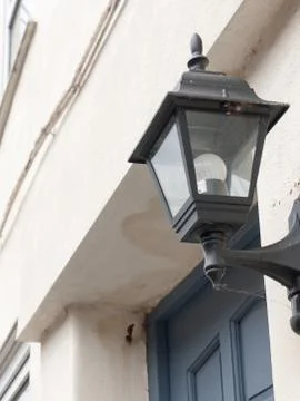 A black lantern outside with the light turned off during the day serious an.. Stock Photos