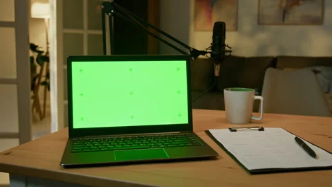 Black Laptop and Clipboard with Script on Table in Studio Stock Footage 310389739