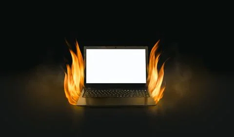 Black laptop computer with burning fire in dark background. Stock Photos