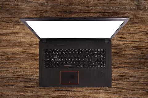 Black laptop over a table. Notebook with empty screen. blank copy space on Stock-Fotos