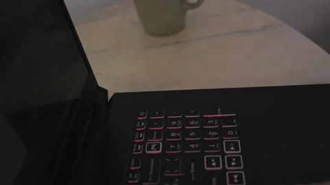 Black laptop stands on a marble table Stock Footage 177433150