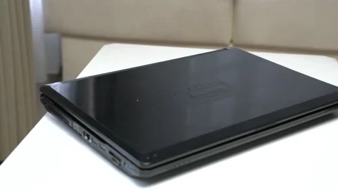 A black laptop on a white table 스톡 동영상 163863239
