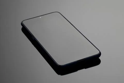 Black large screen smartphone with shadow on glass Stock Photos