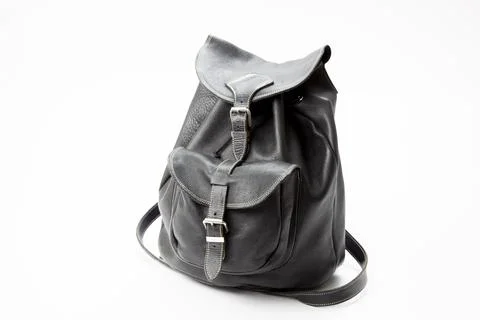 A black leather back pack on a white background Stock Photos