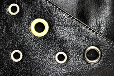 Black leather background with circle studs Stock Photos