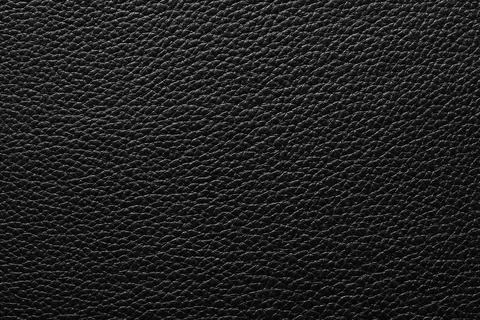 Black leather background, patterned texture of animal skin Stock Photos