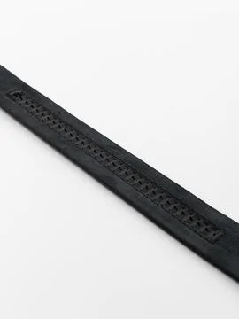 Black leather belt strap perforated edge close up Stock Photos