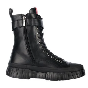 Black leather boot on a white backdrop. Stock Photos