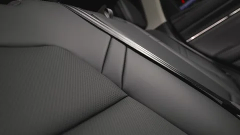 Black leather car interior. Modern car interior, interior parts, interior detail Stock Footage 309403435