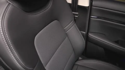 Black leather car interior. Modern car interior, interior parts, interior detail Stock Footage 309403445