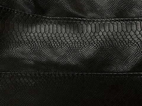 Black leather, clothes, jacket, large seams. Artificial leather Stock Photos
