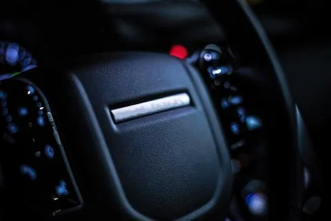 Black leather multi-function steering wheel in the interior of a premium SUV. Foto stock