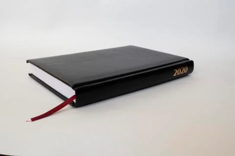 Black leather notebook on white background Stock Photos