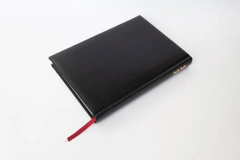 Black leather notebook on white background Stock Photos
