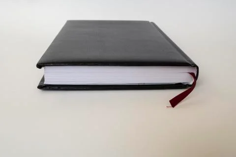 Black leather notebook on white background Stock Photos