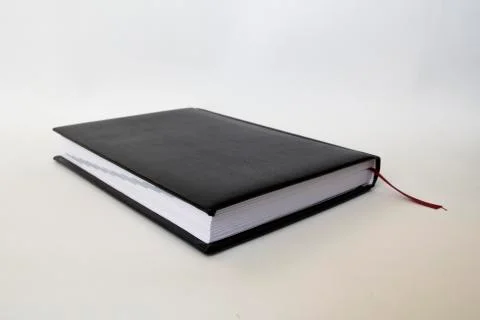 Black leather notebook on white background Stock Photos