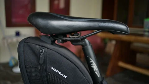 Black leather saddle close up view of mount bike Stock Footage 224846114