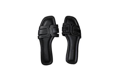 Black Leather Slide Sandals Styled on white Background for Casual Fashion Stock Photos