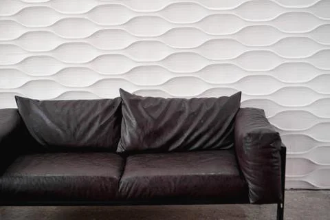 Black leather sofa on white background in studio Stock Photos