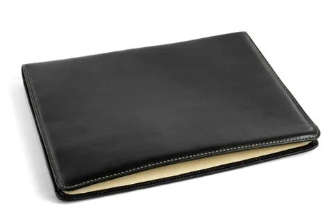 Black leather tablet computer bag Black leather tablet computer bag on a w... Stock Photos