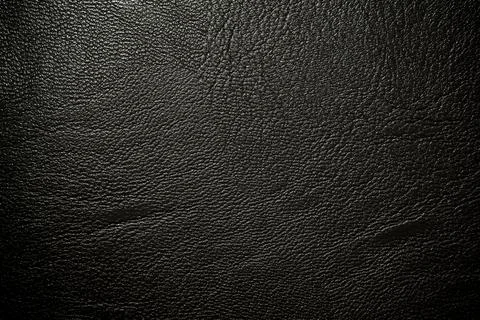 Black leather texture. Abstract background of dark leather with small roughne Stock Photos