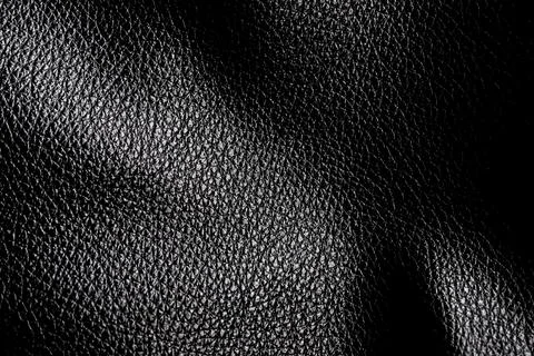 Black leather texture. Abstract background of dark leather with small roughne Stock Photos