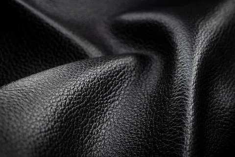 Black leather texture. Abstract background of dark leather with small roughne Stock Photos