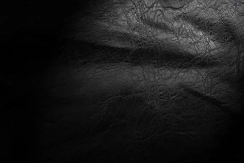 Black leather texture. Abstract background of dark leather with small roughne Stock Photos