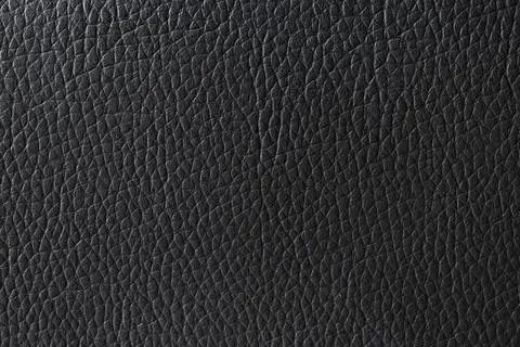 Black leather texture background with natural grain pattern, dark abstract su 库存照片