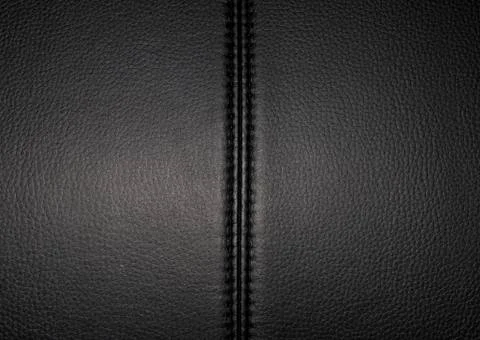 Black leather texture background surface with seam. Stock Photos