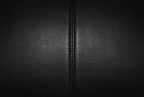Black leather texture background surface with seam. Stock Photos
